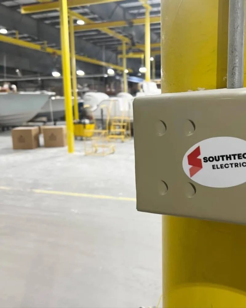 southtech electric sticker on a pole in a large warehouse